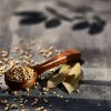 brown wooden spoon filled with seeds
