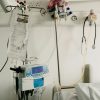 a hospital room with a bed and medical equipment